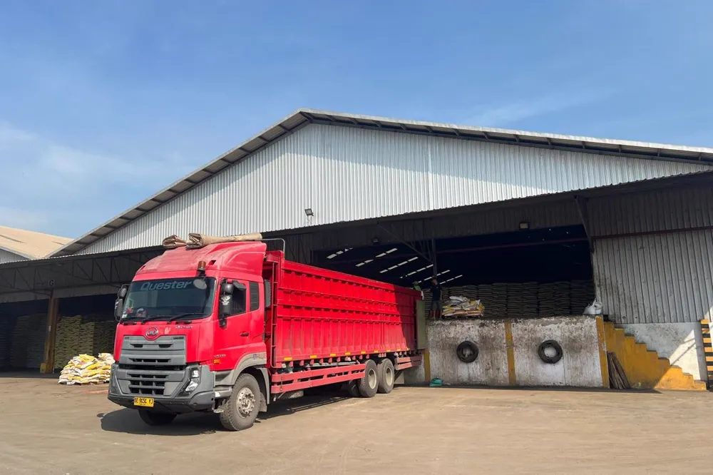 Truck loading Palm Kernel Expeller at an Indonesian warehouse